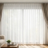 A wide-angle shot of a large living room window featuring a double-track system. Show a Gorden Sheer drawn closed (diffusing lig